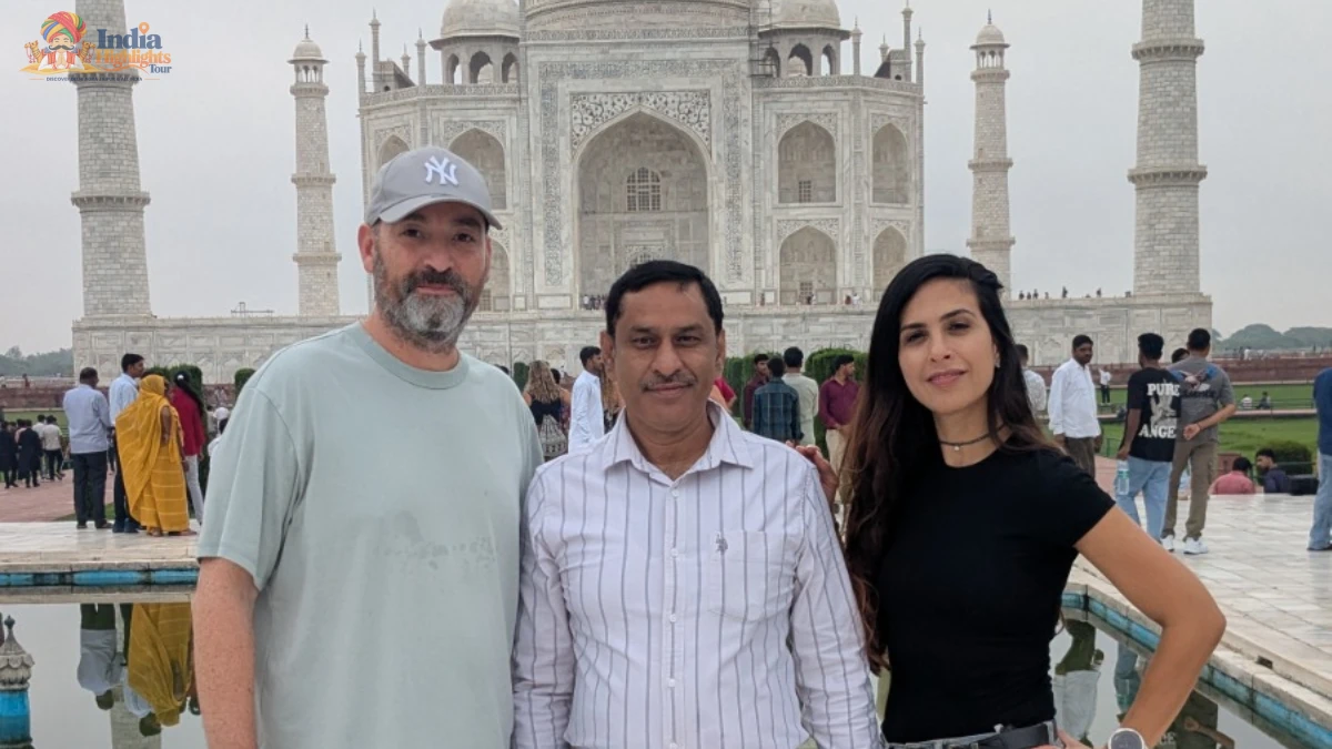 Guests accompanied by their private tour guide in front of the iconic white marble Taj Mahal in Agra
